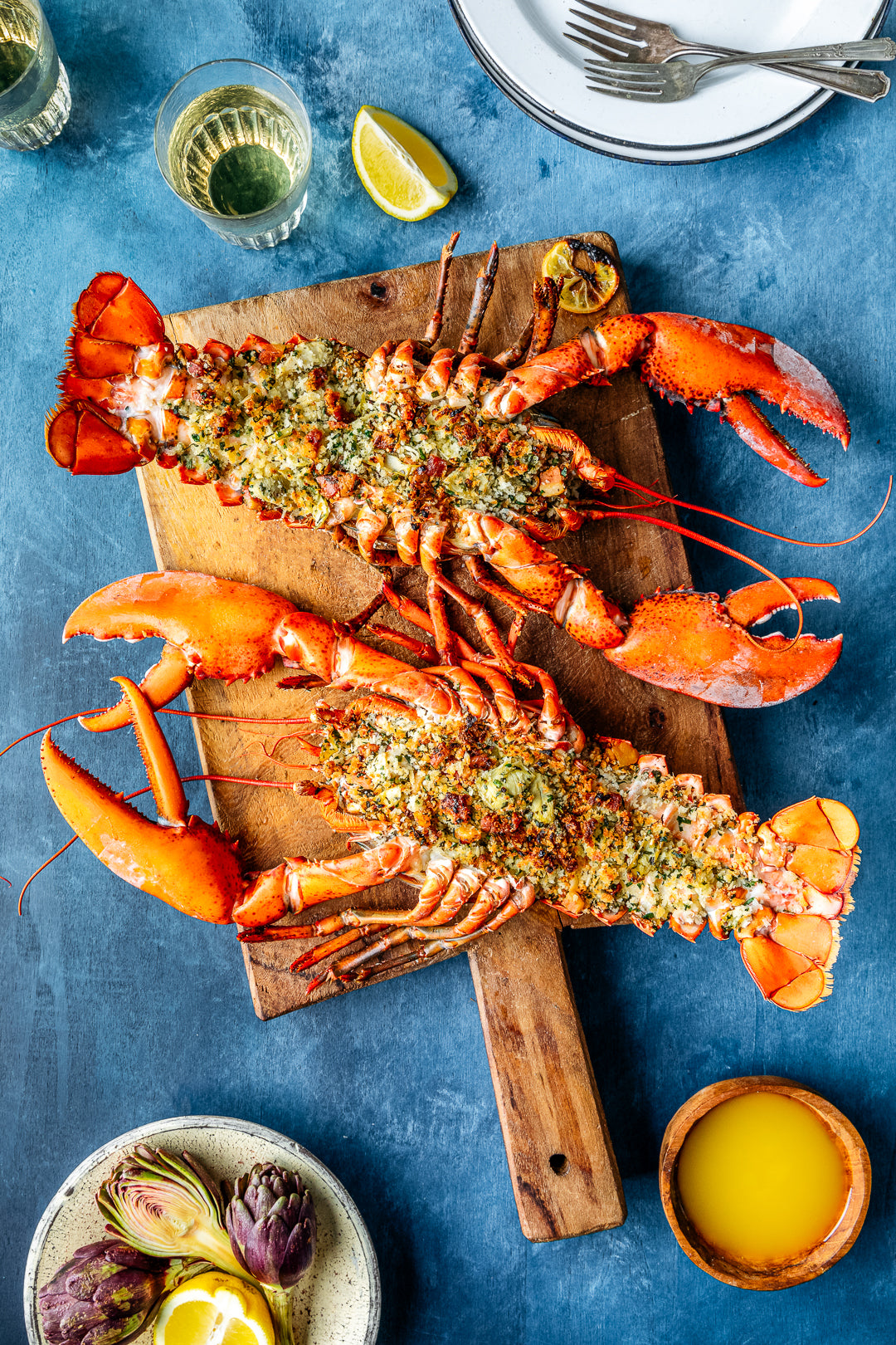 Whole stuffed Maine lobster with herby artichoke and pancetta bread crumbs